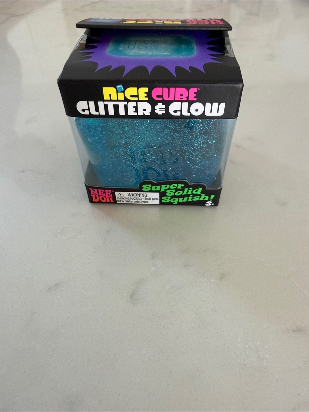 NWT (unopened box) NeeDoh Nice Cube Glitter & Glow Blue Glitter
